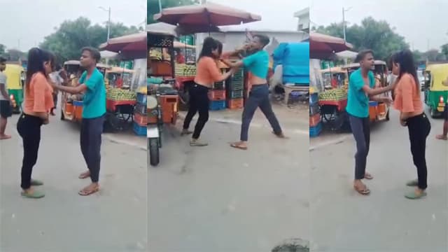 A fight broke out between a boy and a girl on the street, leaving the girl stripped naked